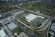 Aerial View Of Planes, Helicopters, And Cars Parked By Buildings