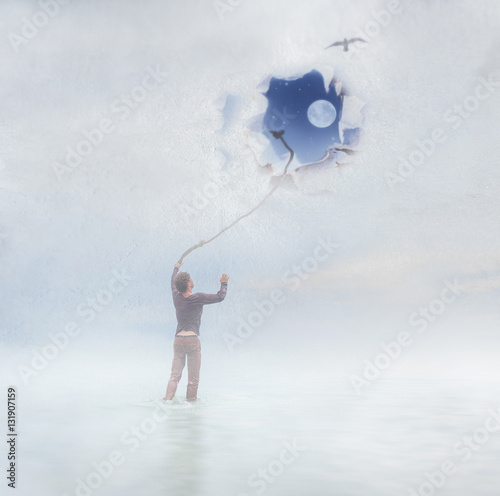 A guy is standing near the window trying to go up and looking outside, imagining boundless space with moon and stars Poster