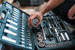 © ADDICTIVE STOCK - Mechanic tidying up tools
