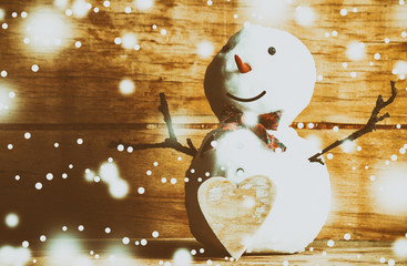 Canvas Print - Snowman on wood desk. 