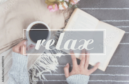 Fotografía relax text and woman hand holding coffee cup of hot drink and read a book on gray carpet