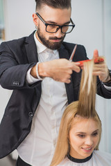 Wall Mural - Concentrated stylist is working at studio