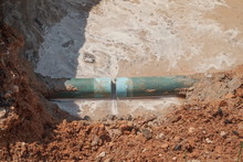 Repair The Plumbing Broken Pipe And Water Flow In Hole.