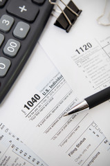 US tax form 1040 with pen and calculator