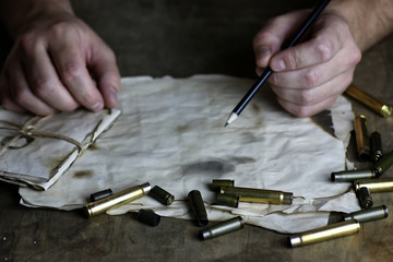 Wall Mural - man write letter retro bullet on the table