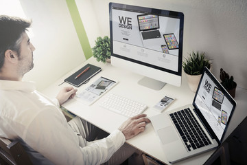 Poster - man working with devices we design