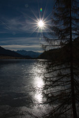 Sun over frozen Haidersee (lake)