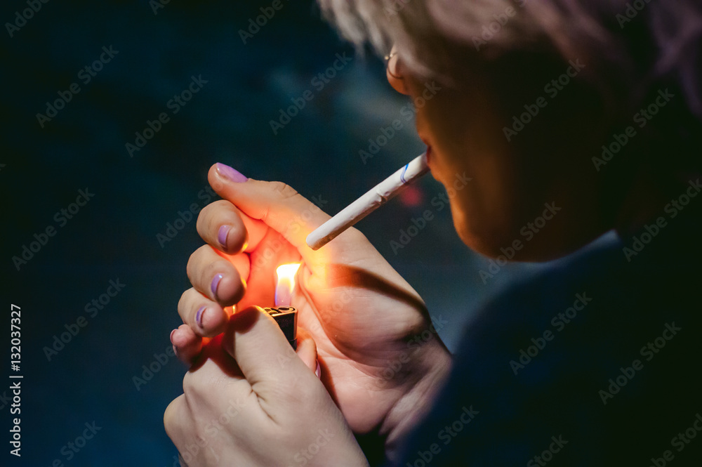 Portrait of a girl with a cigarette. young beautiful girl hipster with dyed  hair smoking a