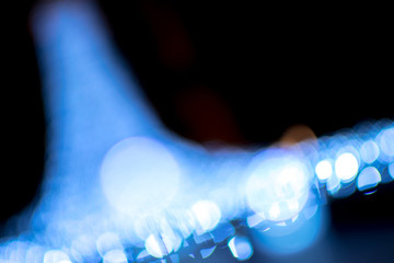 Wall Mural - Abstract bokeh and lens flare pattern in the dark with vintage filter background