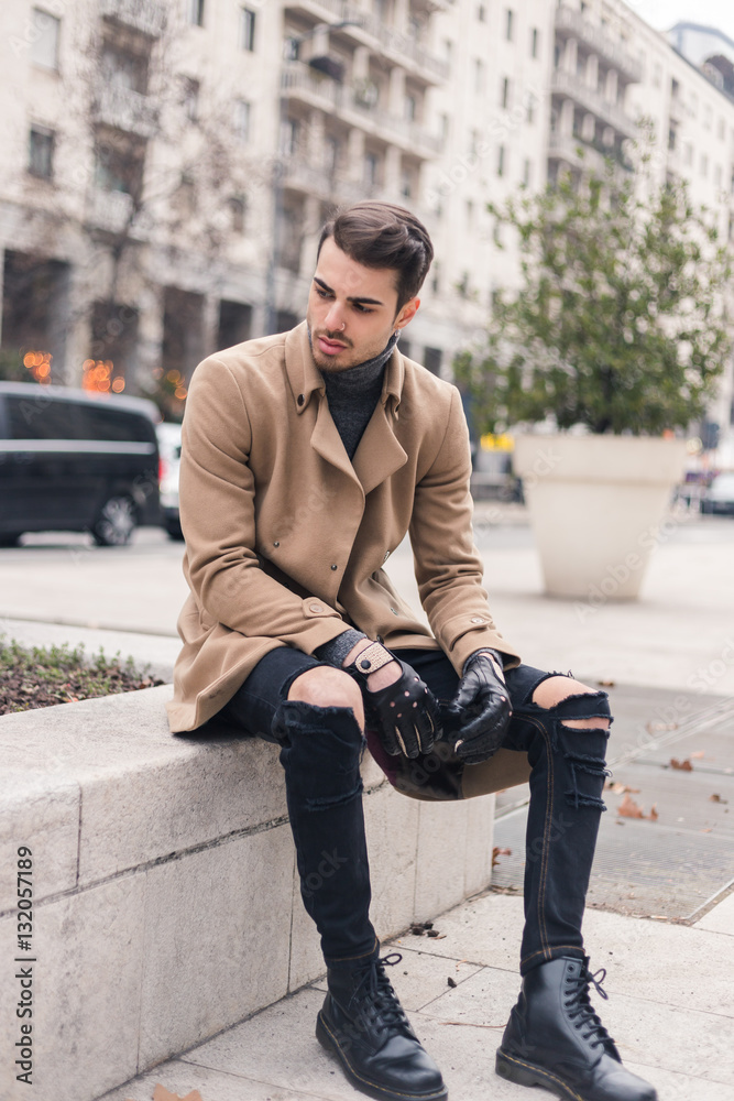 Beautiful young man posing in an urban context Stock Photo | Adobe Stock