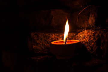 candle light on brick wall.