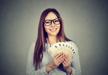 young business woman holding money