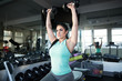 © Mat Hayward - Strong, determined and beautiful woman lifting weights in gym