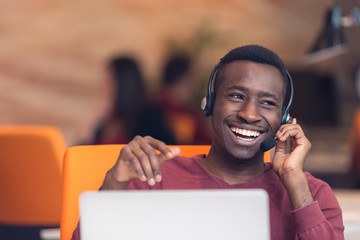 Customer Service agent in an startup office with laptop