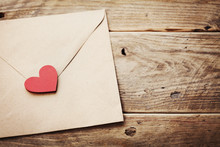 Envelope Or Letter And Red Heart On Vintage Wooden Table For Love Message On Valentines Day In Retro Toning.