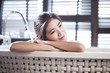 © Blue Jean Images - Beautiful young woman relaxing in bathtub