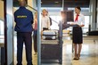 © Wavebreak Media - Airport security guard with passenger walking through scanner
