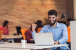 © FS-Stock - Young bearded caucasian modern business man sitting in a startup office