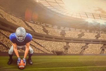 Poster - Composite image of american football player placing ball 3d 