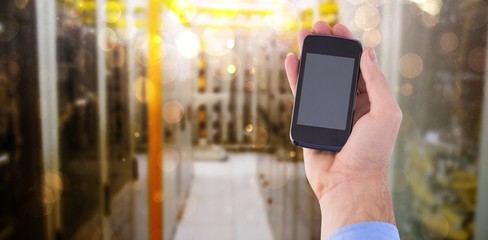 Poster - Composite image of hand of businessman showing smartphone 3d