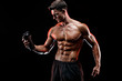 © ZaStock - Muscular man with protein drink in shaker over dark background