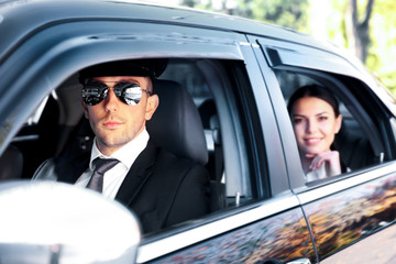 Poster - Businesswoman riding a car with chauffeur