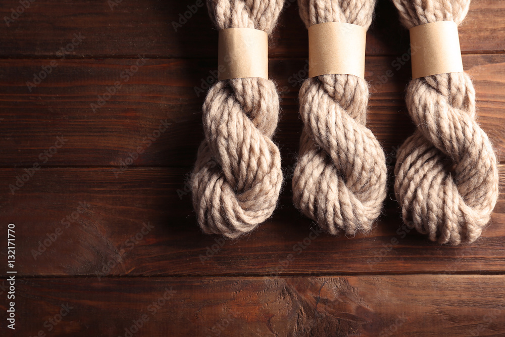 Knitting yarn on wooden background