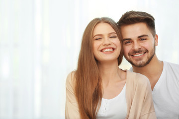 Poster - Portrait of cute young couple at home