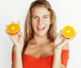 young pretty blond woman with half oranges close up isolated on white bright teenage smiling