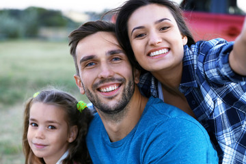 Poster - Parents with kid taking photo