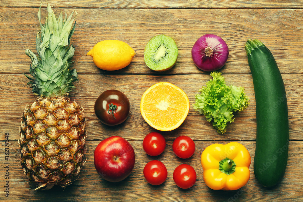 Colourful fruits and vegetables on wooden background