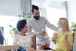 © Syda Productions - happy creative team drinking coffee in office