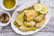 Baked fennel with herbs and olive oil served with fried fish.