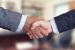 © Sondem - Business People Shaking Hands