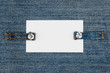 Business card with two straps jeans, lies on the light denim
