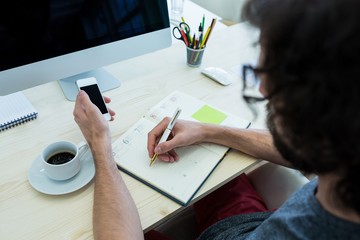Aufkleber - Business executive writing in diary