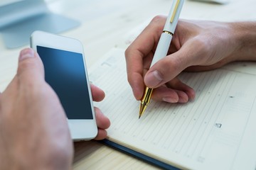 Aufkleber - Business executive writing in diary