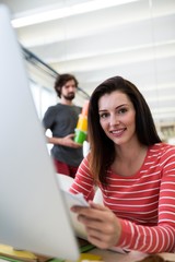 Aufkleber - Female graphic designer sitting at desk