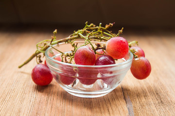 Fresh red grape on glass