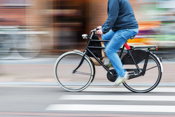 Wall Mural - bicycle rider in motion blur