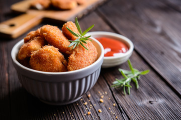 Wall Mural - Fried breaded chicken nuggets with tomato sauce