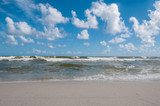 Fototapeta Morze - Blue sky and waves on beach at Gulf Shores Alabama