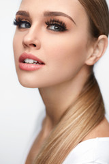 Wall Mural - beauty woman face. beautiful female with makeup, long eyelashes
