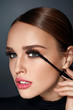 Beauty Cosmetics. Woman Putting Black Mascara On Long Eyelashes