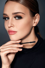 Wall Mural - cosmetics. girl with perfect makeup, long eyelashes and mascara