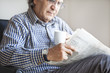 © sebra - Senior man reading newspaper