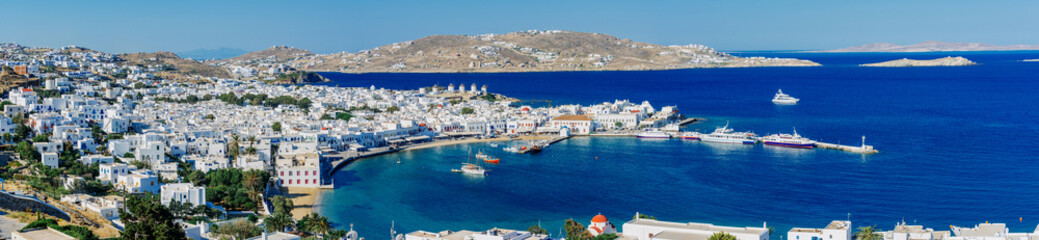 Wall Mural - Panoramic view of sunrise over Mykonos port, Mykonos island, Cyclades archipelago, Greece.