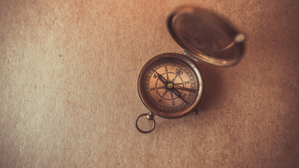old compass collection on brown paper background. (vintage style)