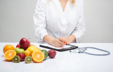 Healthy life style concept, doctor writing, diet and losing weight