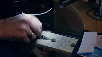 Wall Mural - Jeweler at work in jewelery workshop